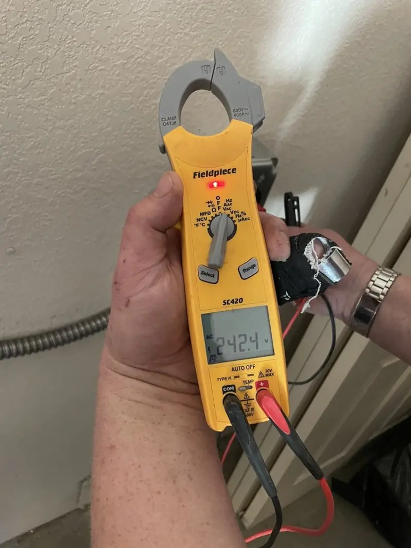 Voltage testing with clamp meter during Ceiling Fan Installation in London Grove